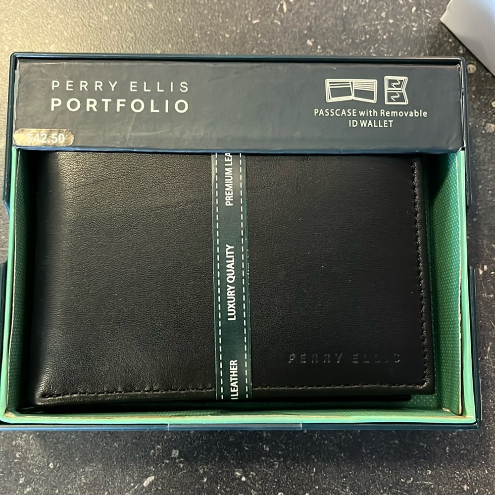 Perry Ellis Portfolio wallet with removable id sleeve in black leather.